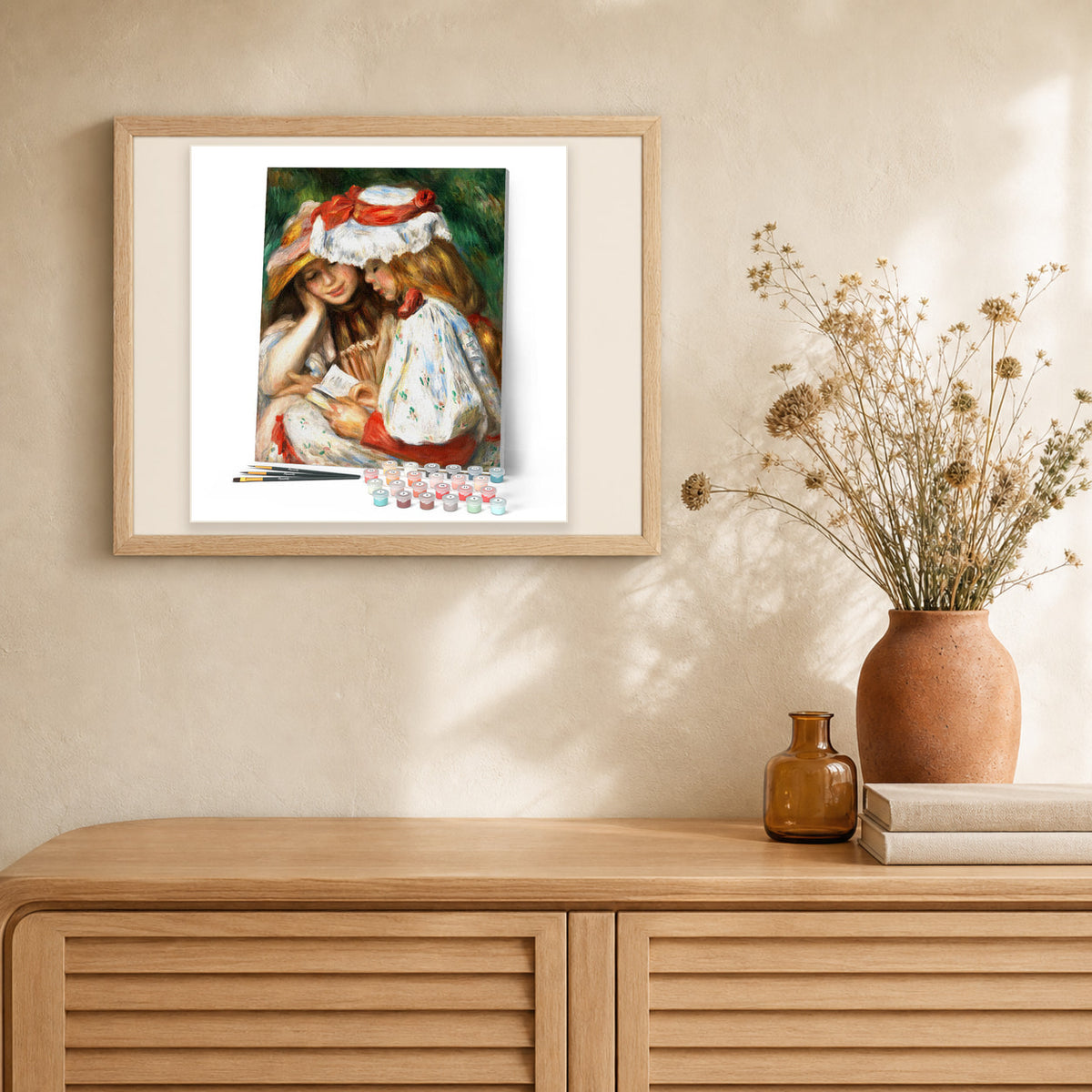 Young girls reading - Renoir artwork displayed in a warm interior