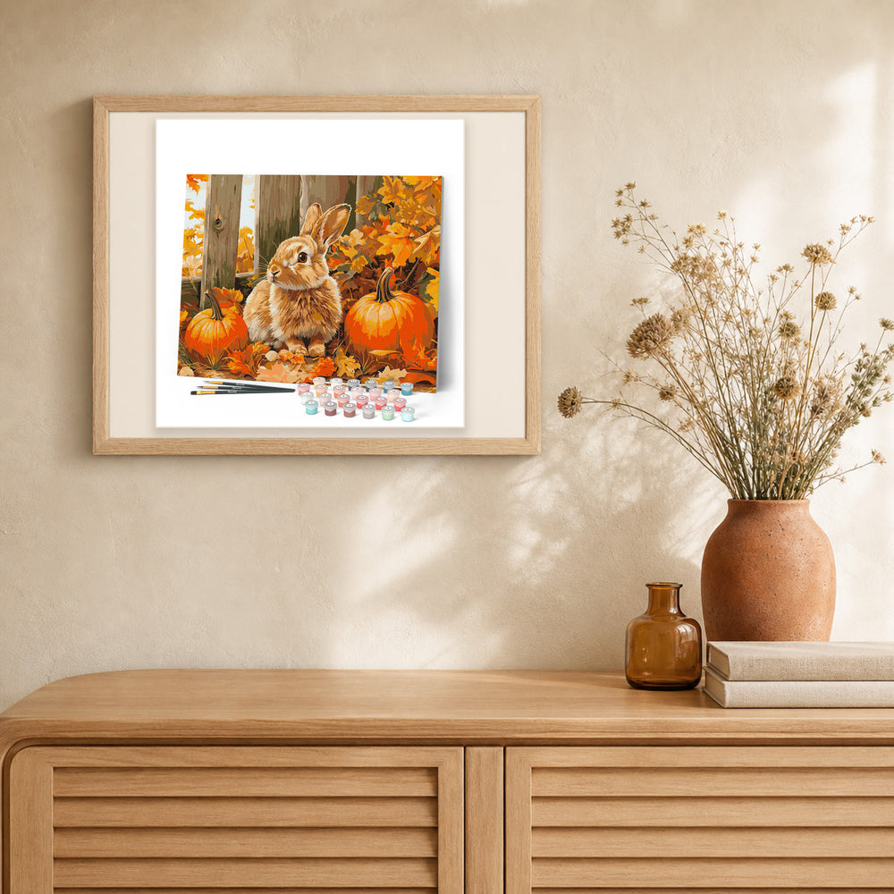 Bunny and Pumpkins artwork displayed in a warm interior