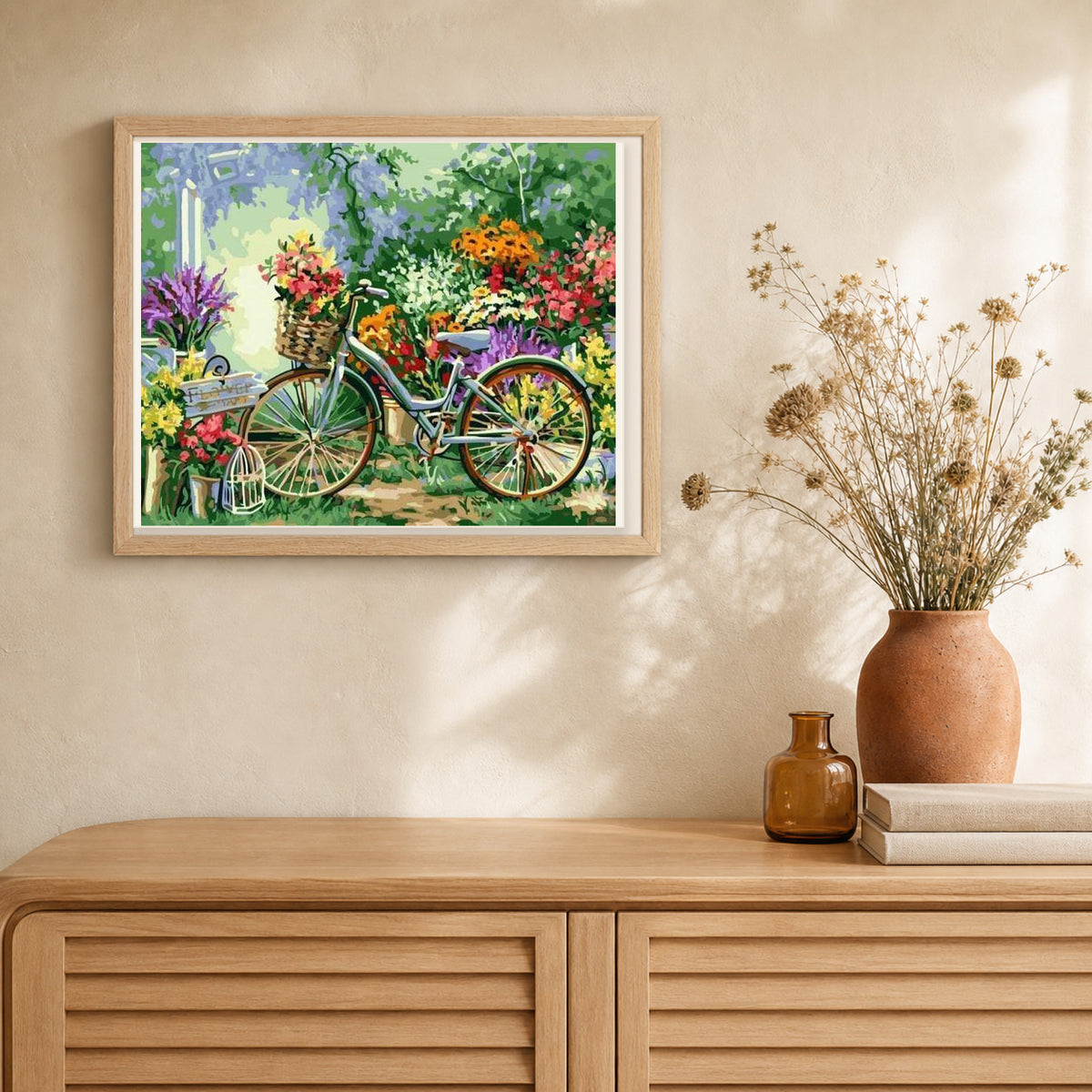Flowers and Bicycles artwork displayed in a warm interior