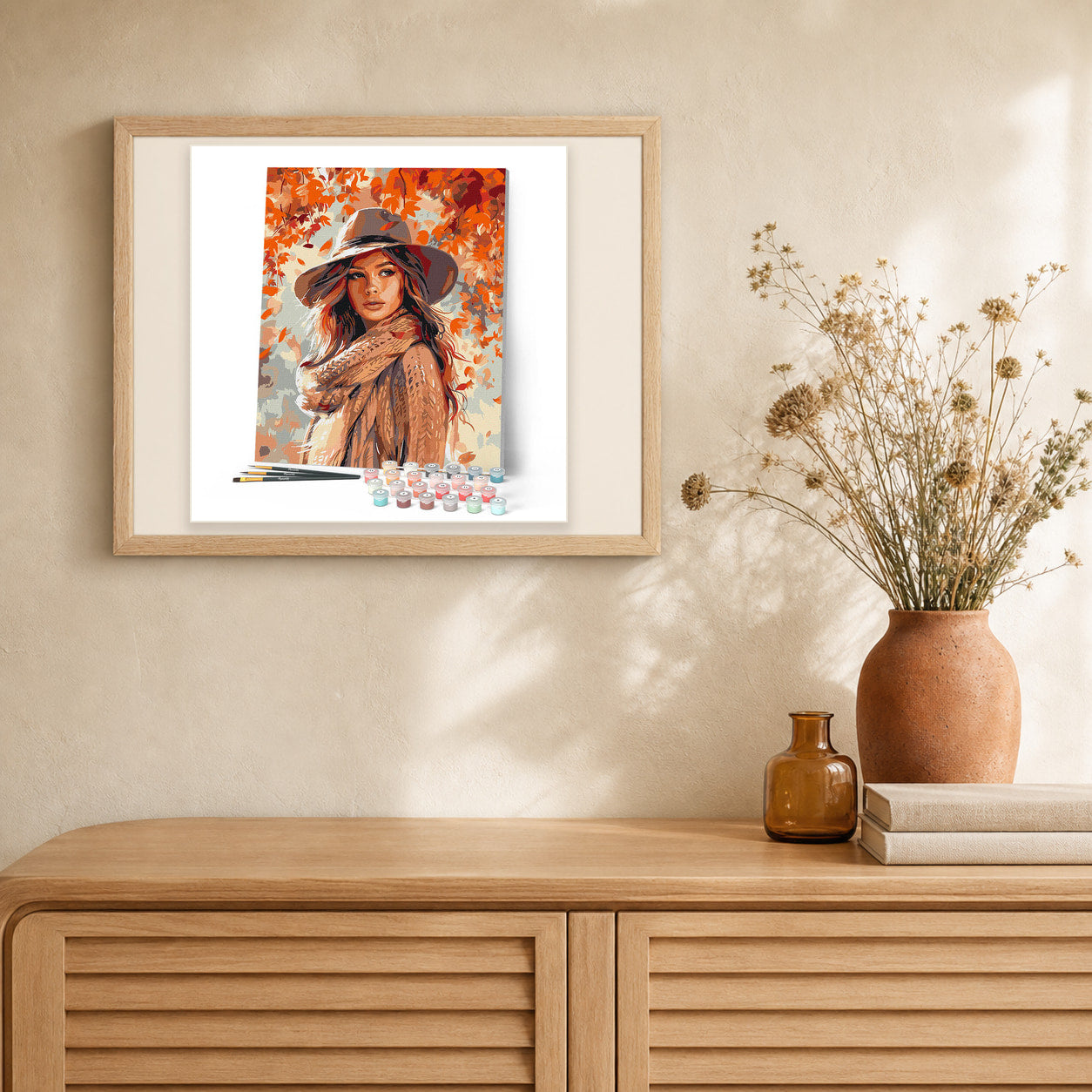 Lady of the Fall Winds artwork displayed in a warm interior