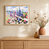 Flowers and seaside background artwork displayed in a warm interior