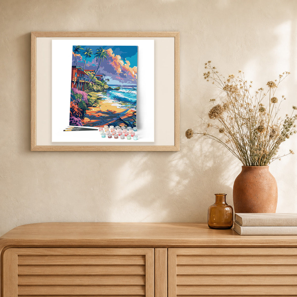 Beachside houses artwork displayed in a warm interior