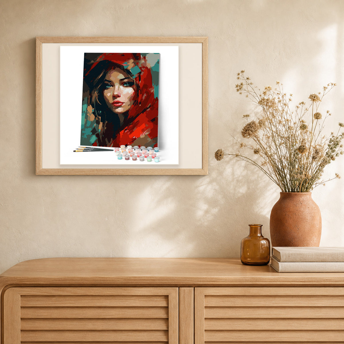 Woman in Red Scarf artwork displayed in a warm interior