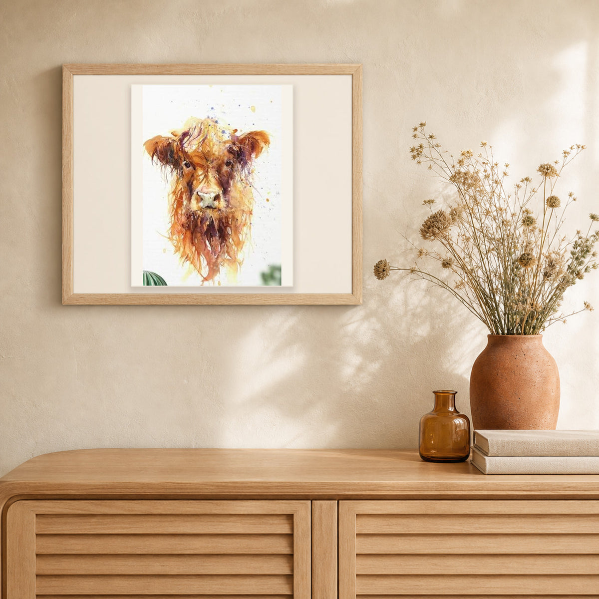 Yellow Cow artwork displayed in a warm interior