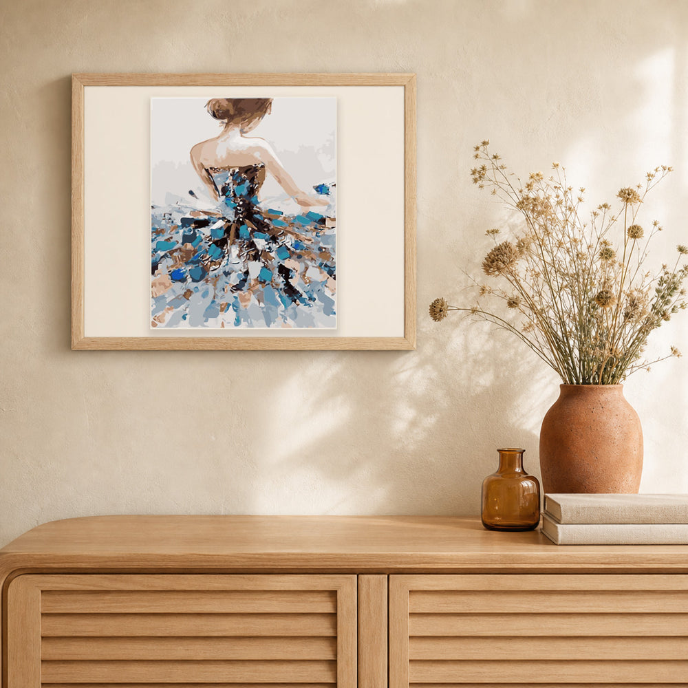Classical ballet dancer artwork displayed in a warm interior