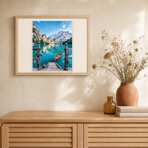 Boat on the Mountain Lake artwork displayed in a warm interior