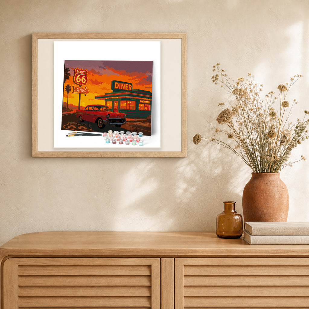 The Diner and Vintage Car artwork displayed in a warm interior
