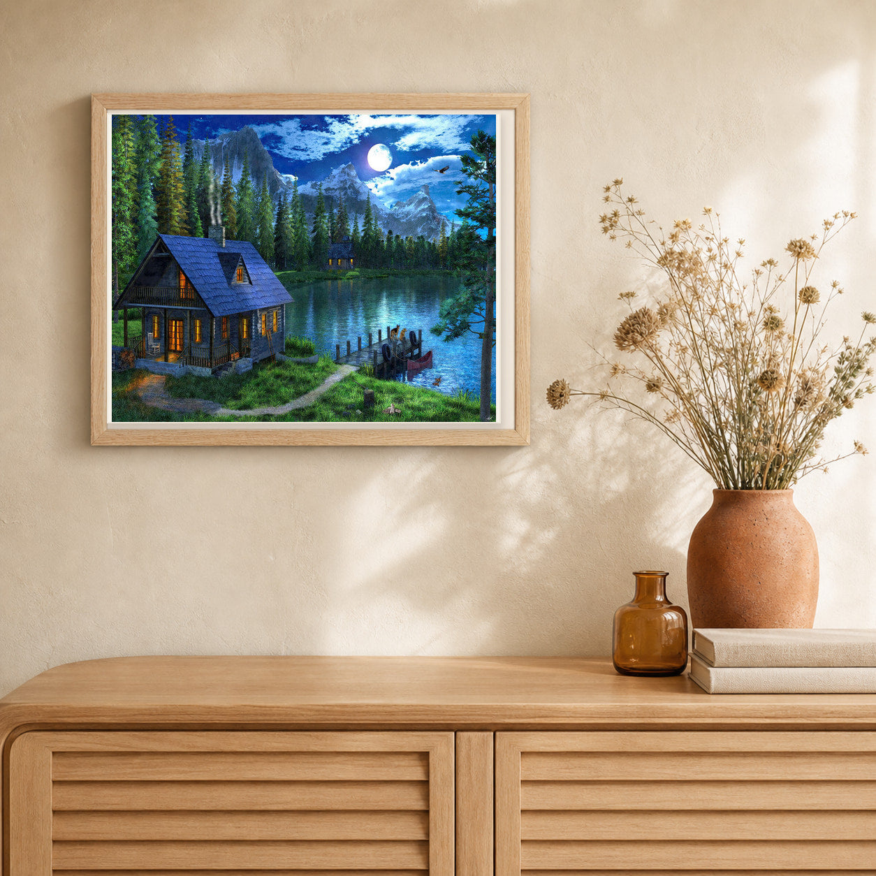 Nocturnal lake artwork displayed in a warm interior