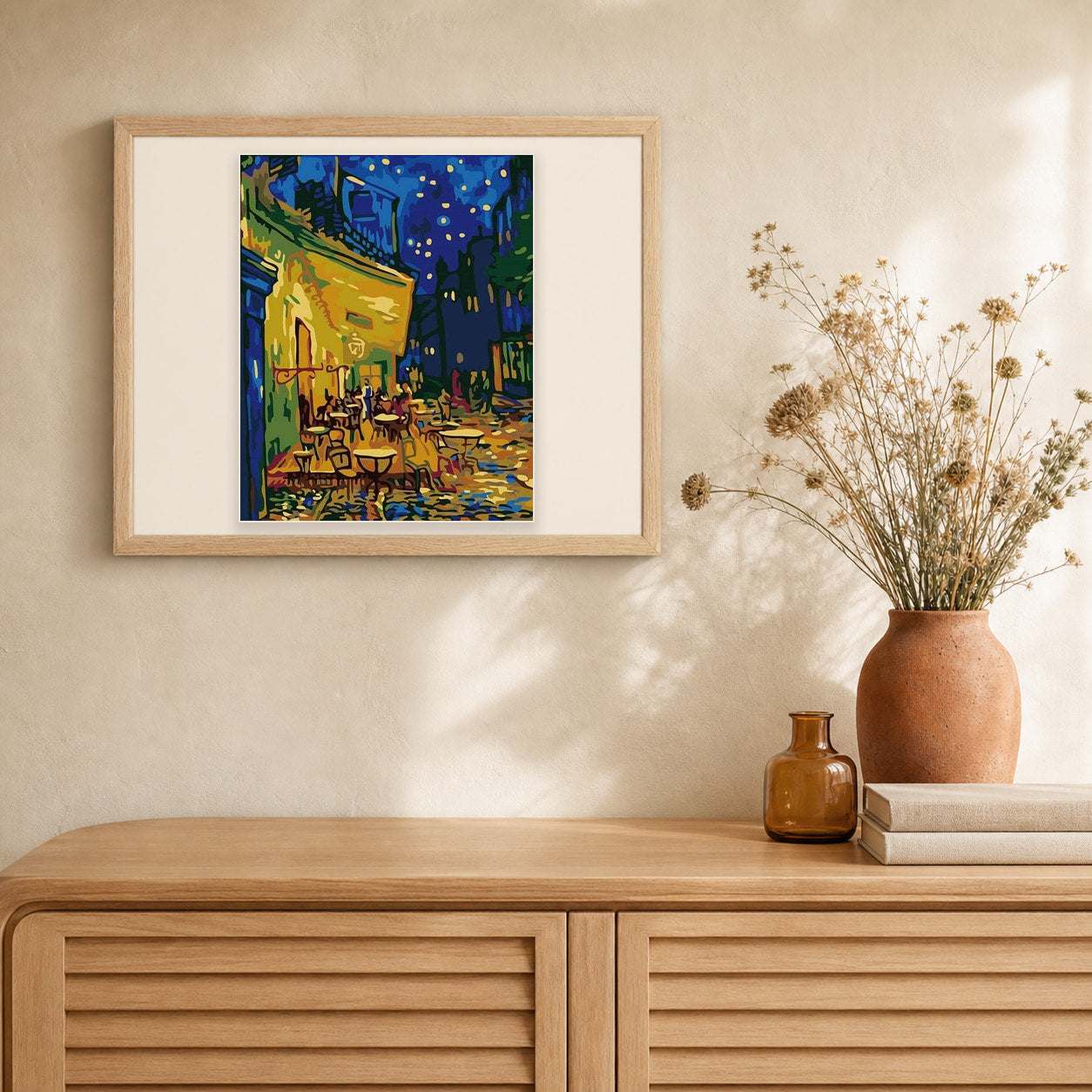 Van Gogh Café Terrace at Night artwork displayed in a warm interior