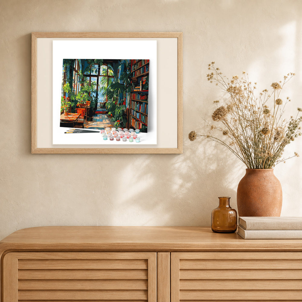 Greenhouse Library artwork displayed in a warm interior