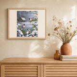 Three Birds in the Snow artwork displayed in a warm interior