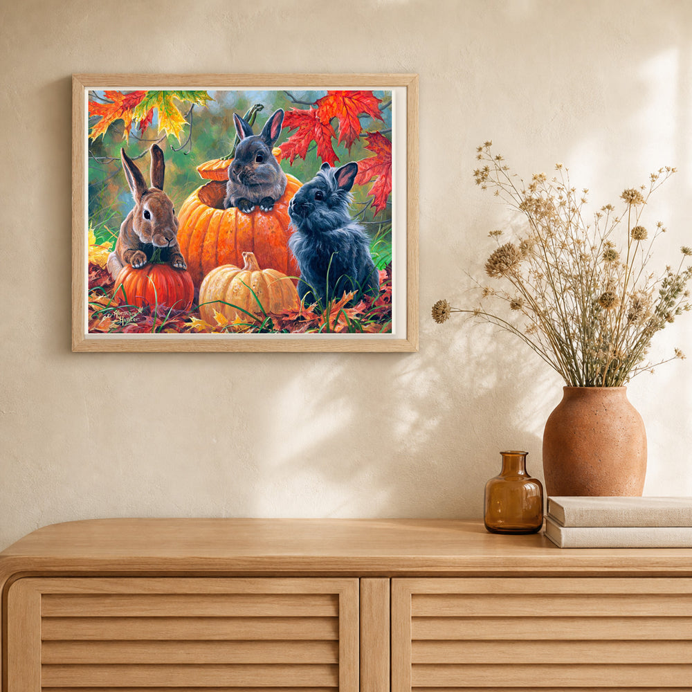 Trio of Rabbits artwork displayed in a warm interior