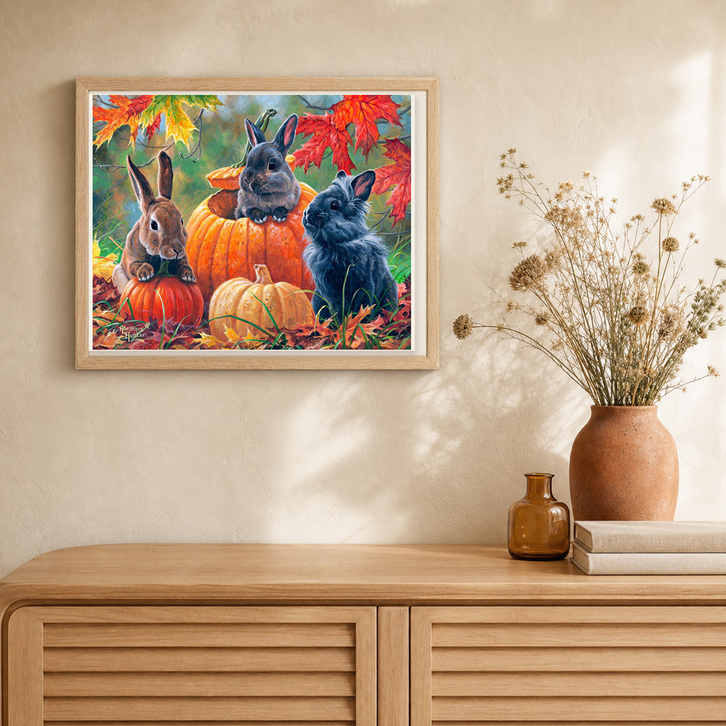Trio of Rabbits artwork displayed in a warm interior