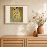 The Kiss - Gustav Klimt artwork displayed in a warm interior