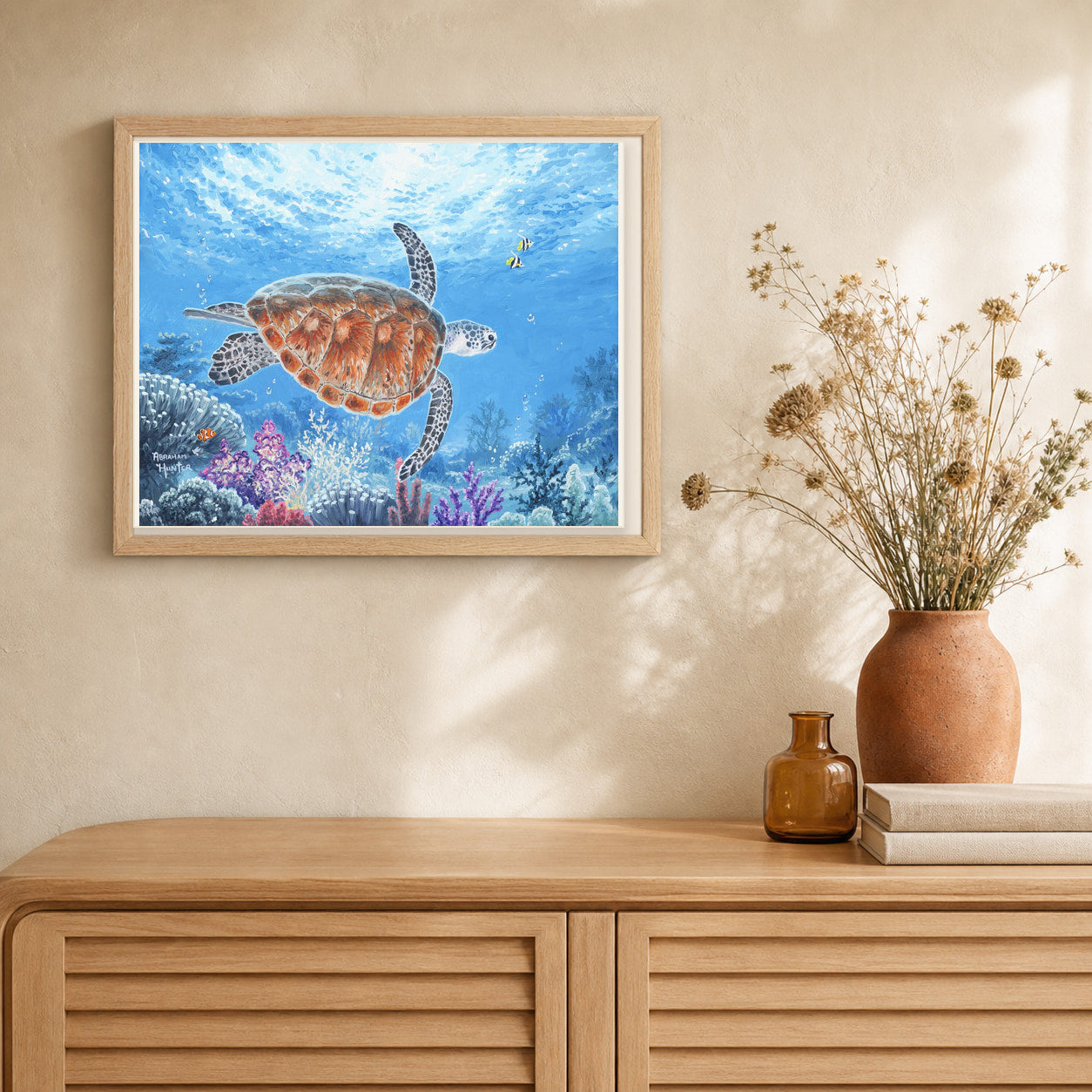 Turtle artwork displayed in a warm interior