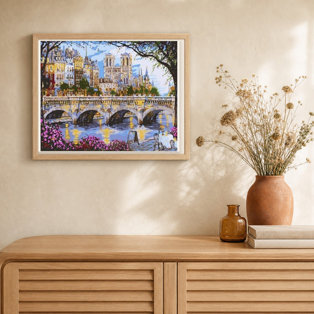 Notre Dame de Paris and the Seine artwork displayed in a warm interior
