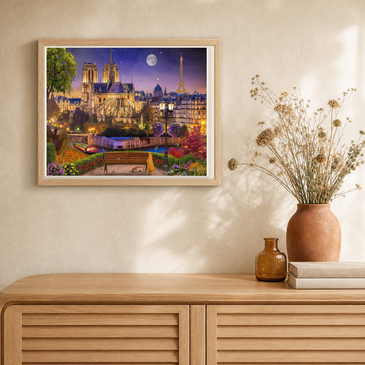 Notre-Dame and Eiffel Tower at night artwork displayed in a warm interior
