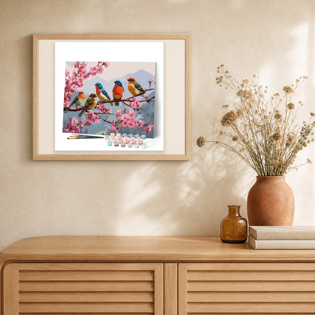 The Band of Songbirds artwork displayed in a warm interior