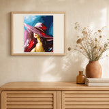Woman with a Hat artwork displayed in a warm interior