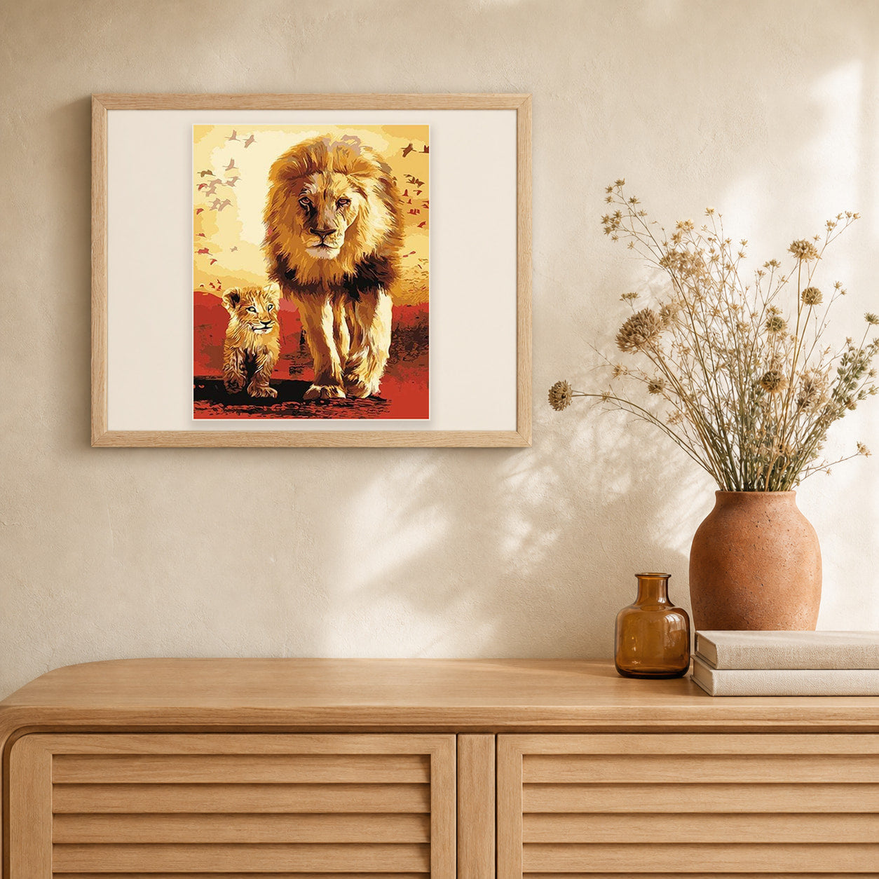 Lion and cub artwork displayed in a warm interior